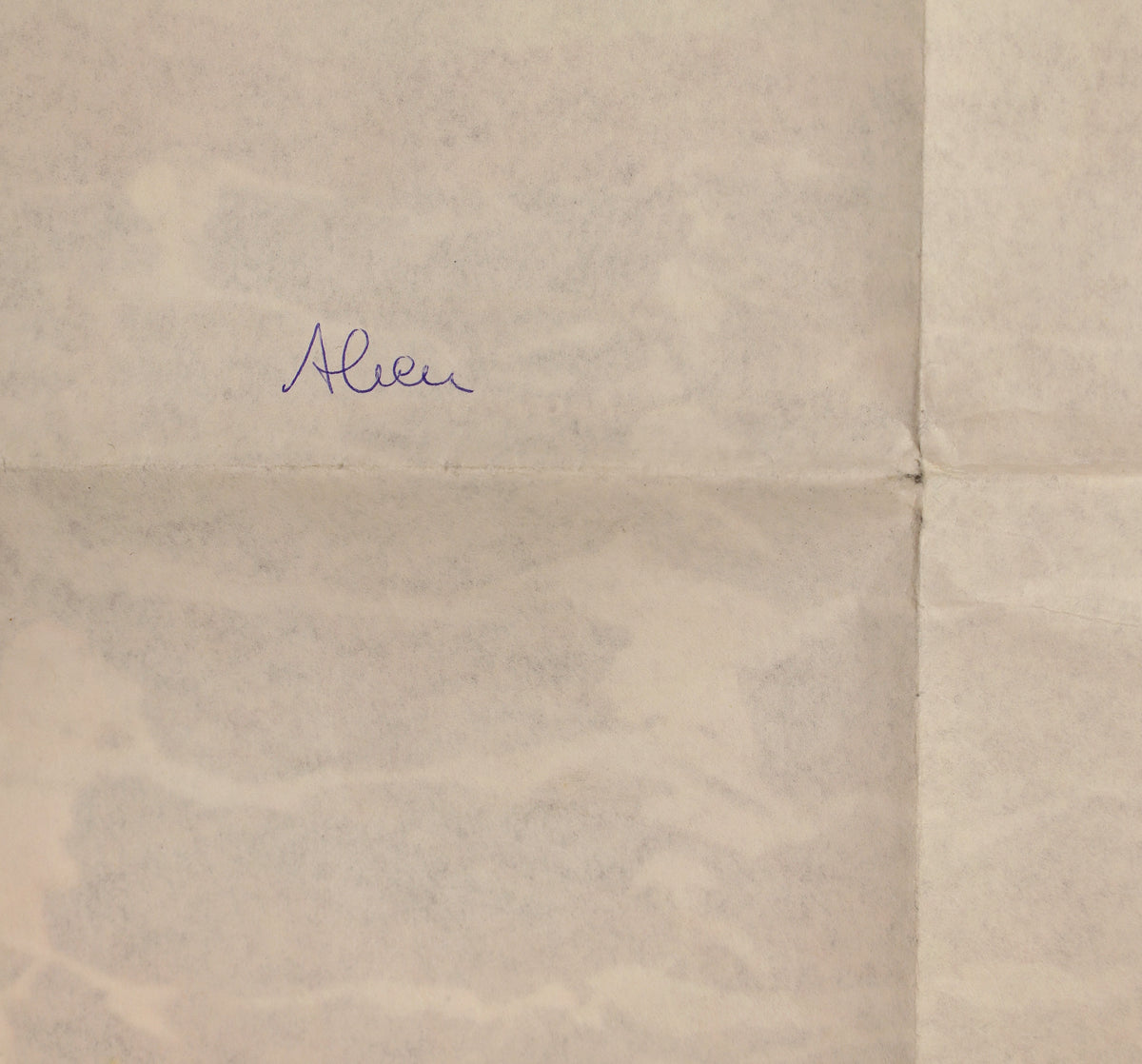 Close-up of handwritten “Alien” notation on the reverse of the poster near a fold line.
