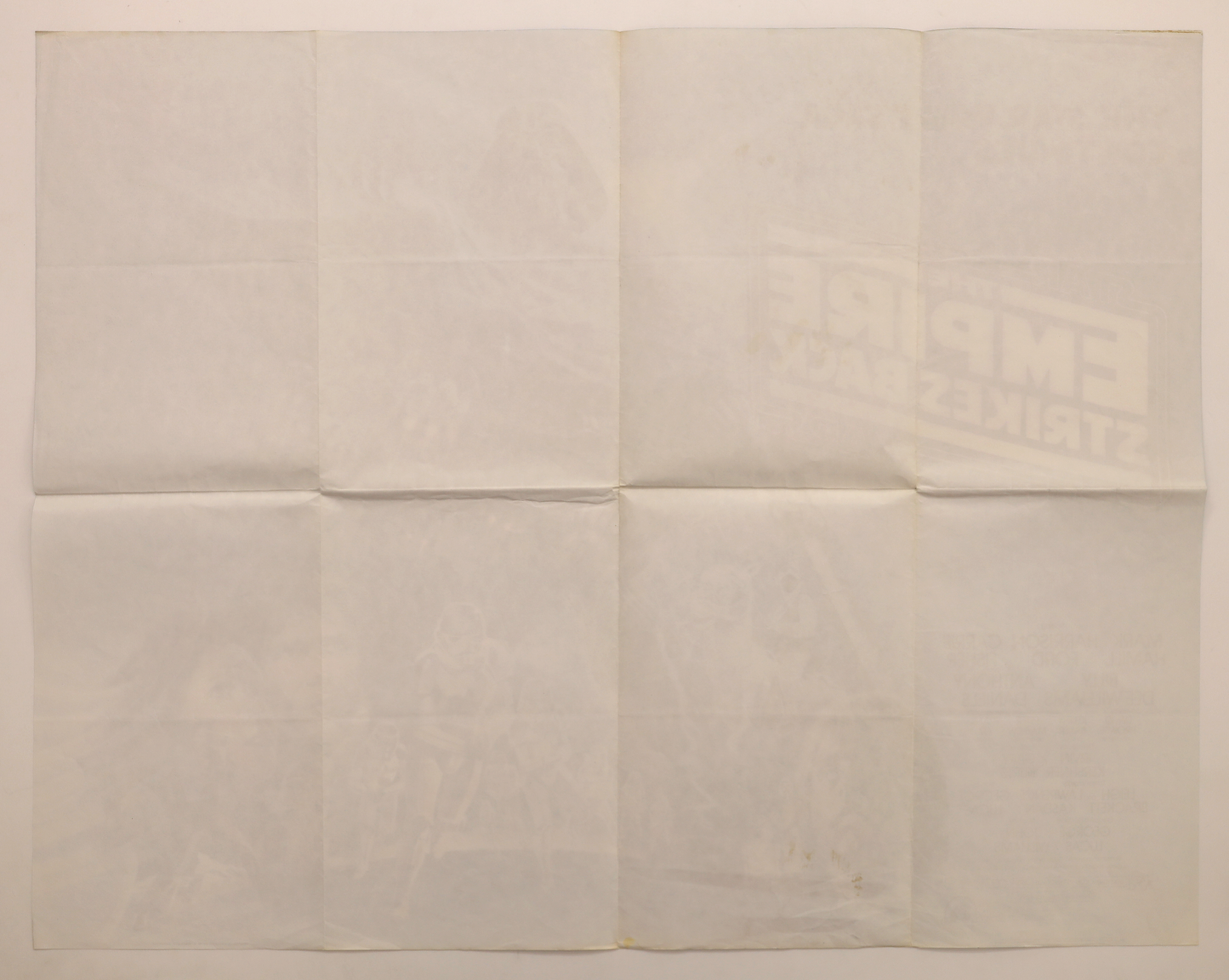 Back of original The Empire Strikes Back (1980) U.K. 30x40 movie poster showing original fold lines and reverse printing.