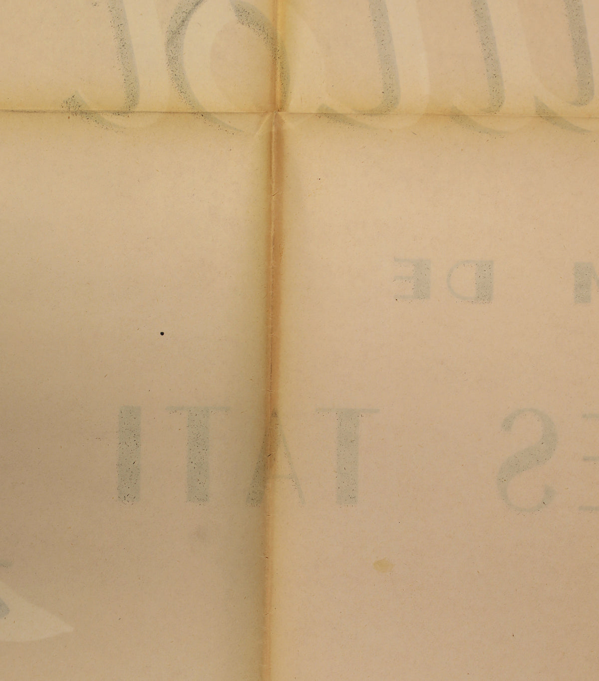 Close-up of the reverse showing original fold lines, paper toning, and faint bleed-through of the front artwork.