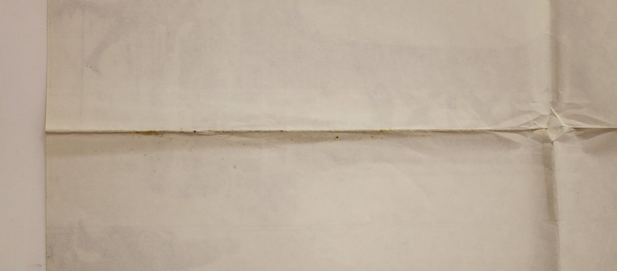 Close-up of the upper portion of the black poster showing Renato Casaro artwork credit and a visible horizontal fold.