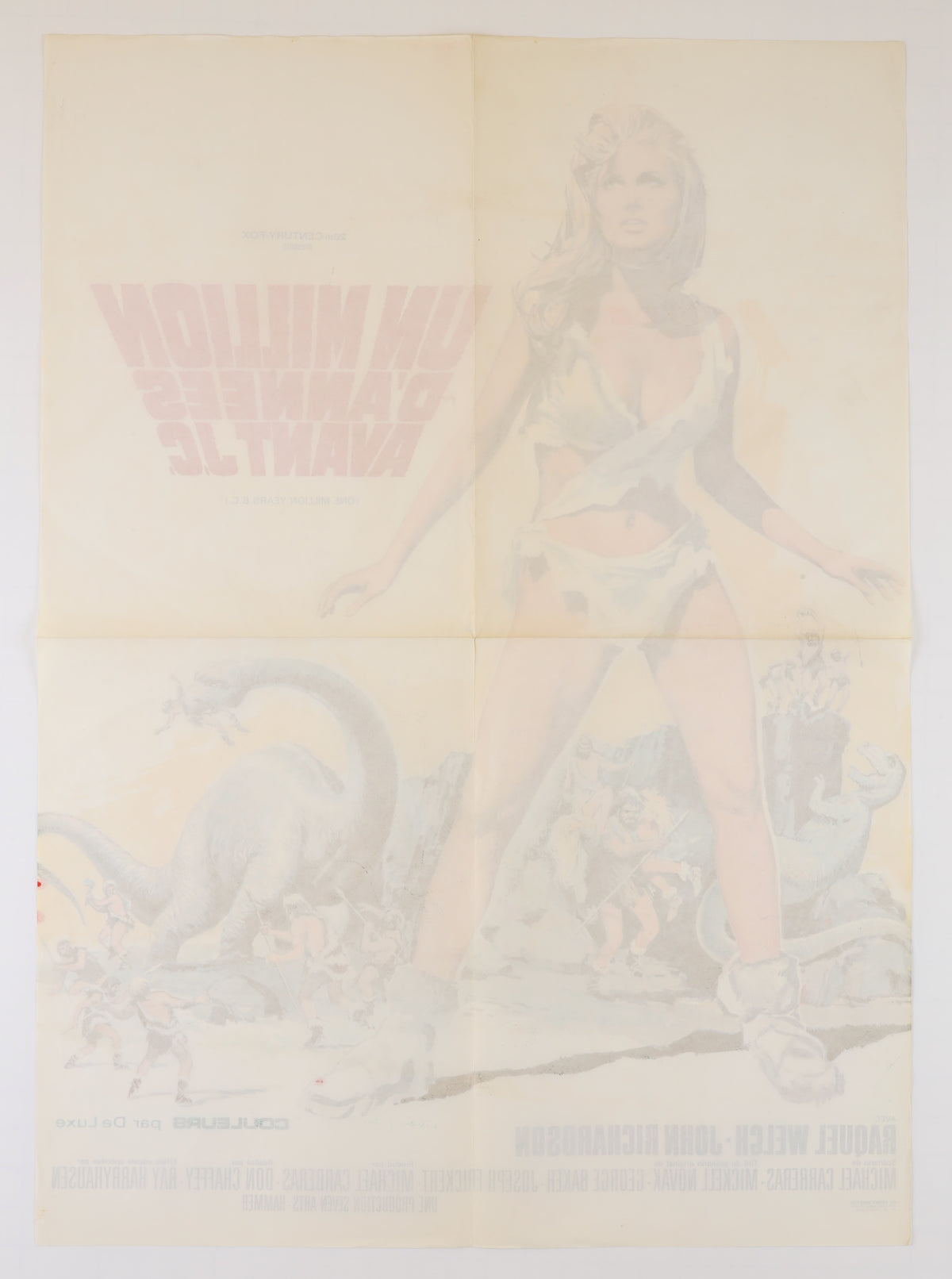 Full reverse of the folded French One Million Years B.C. poster showing multiple horizontal and vertical fold lines, overall toning, and strong bleed-through from the front artwork.