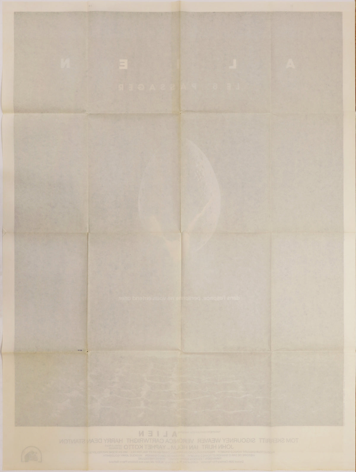 Full reverse of the folded French Alien poster showing fold lines, light toning, and faint bleed-through of the front artwork.
