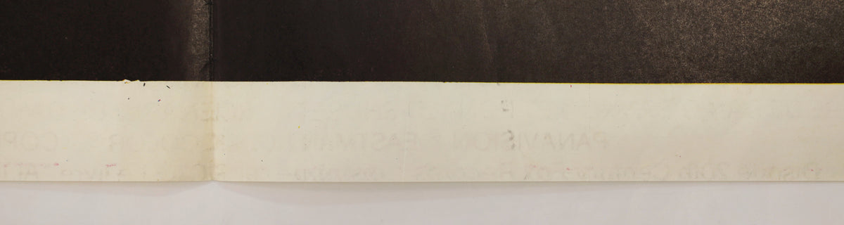 Close-up of the lower poster edge showing the printed border, surface marks, and fold-related wear.