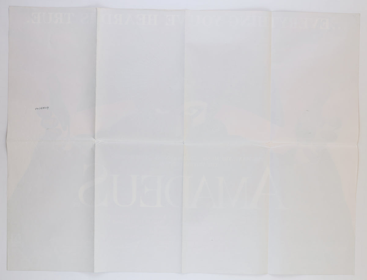 Full reverse of the folded Amadeus U.K. Quad showing multiple horizontal and vertical fold lines, faint bleed-through from the front artwork, and a small handwritten marking.