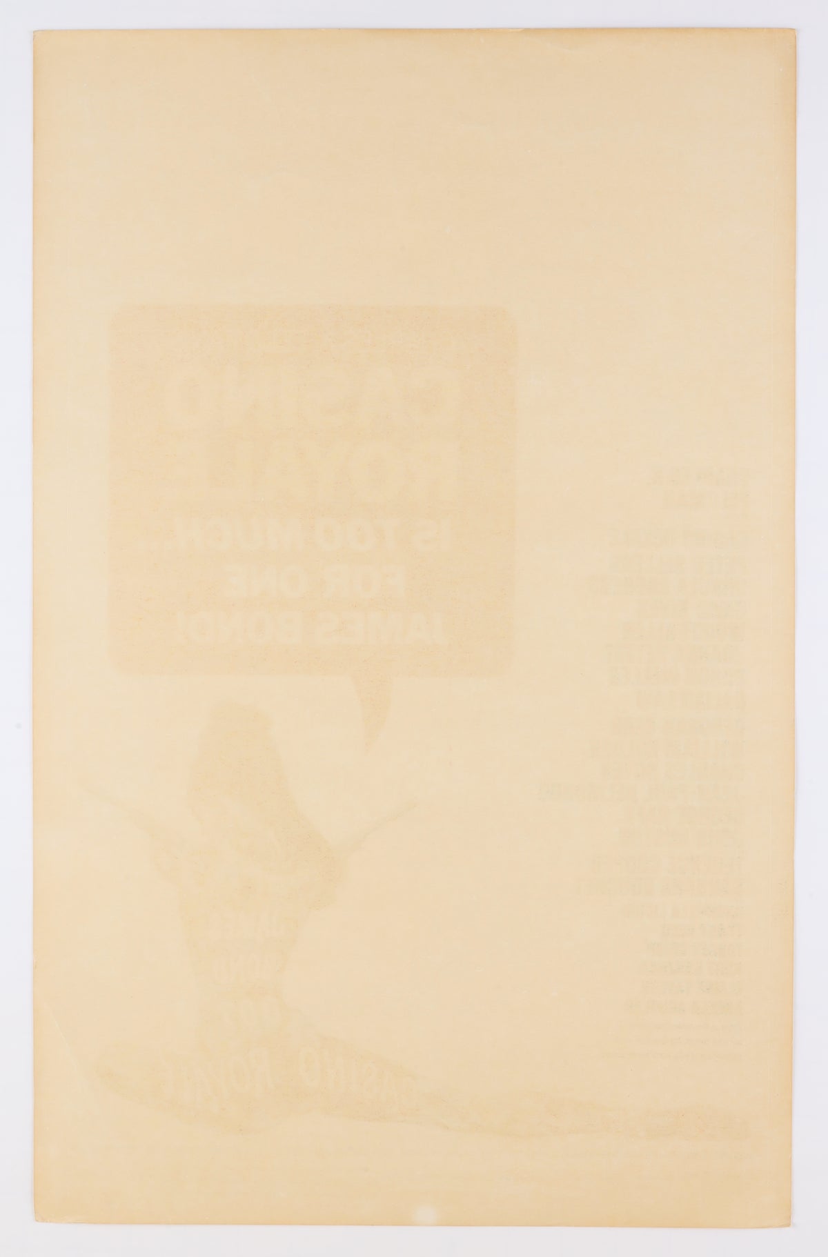 Full reverse of the 1967 Casino Royale U.S. window card showing overall age toning, discoloration, and strong bleed-through from the front artwork.