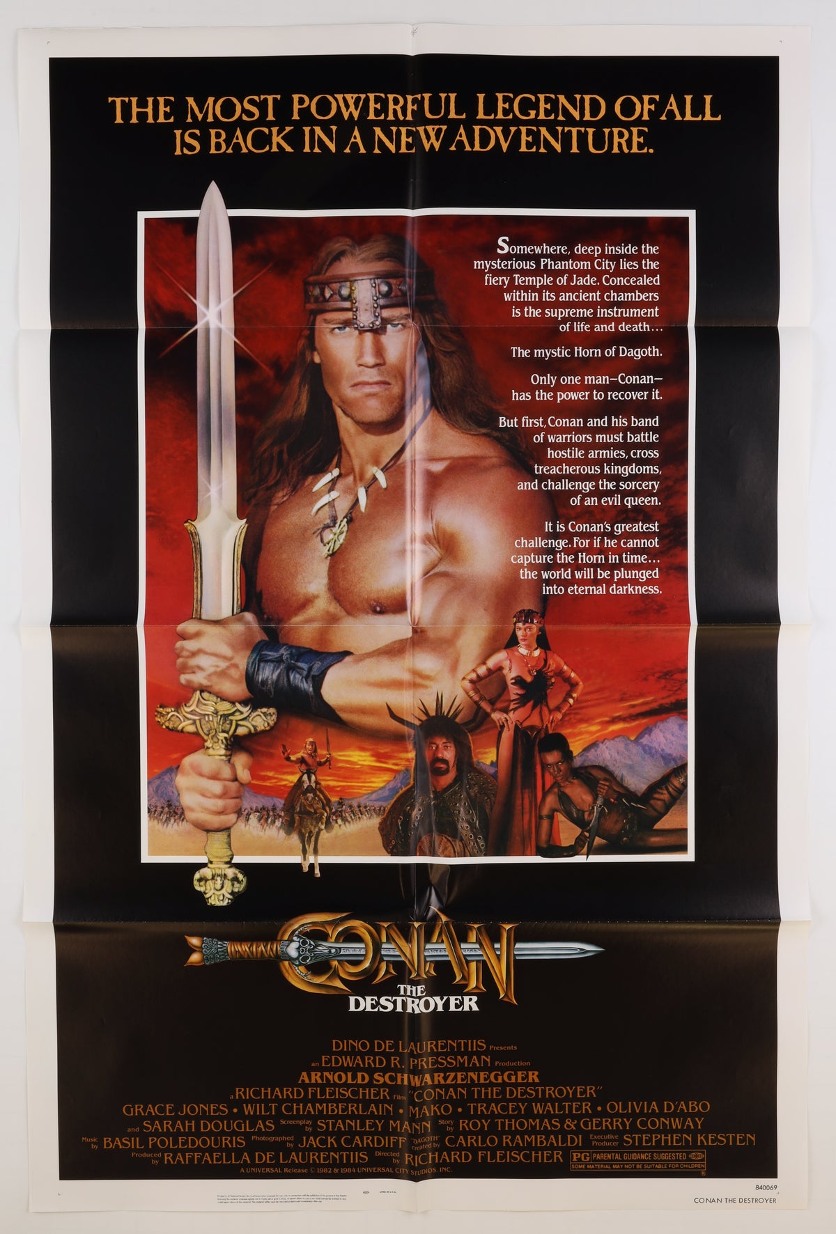 Full front view of the 1984 Conan the Destroyer U.S. one sheet featuring Arnold Schwarzenegger as Conan, fantasy artwork, the film synopsis, cast credits, and Universal Pictures information.