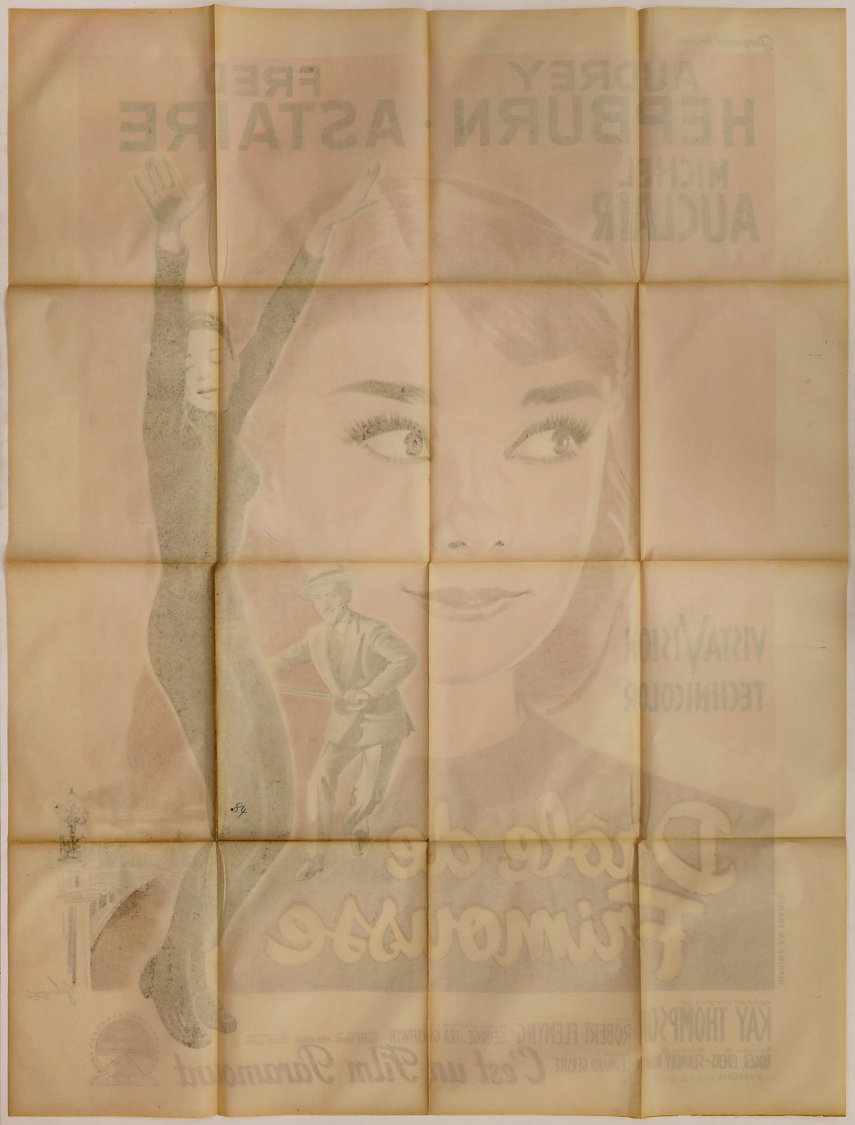 Full reverse showing the complete fold grid, overall toning, surface spotting, and substantial bleed-through of the front artwork.
