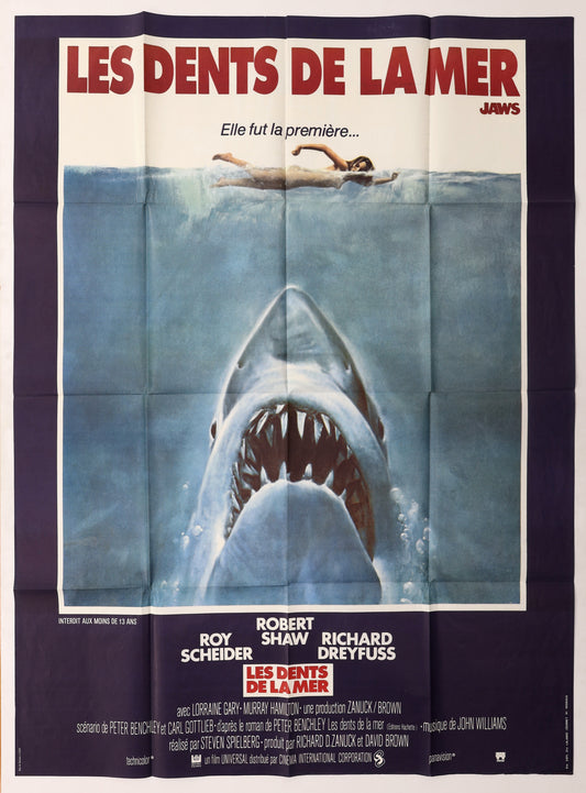 Original Jaws (1975) French Grande movie poster featuring the iconic shark approaching a swimmer beneath the title Les Dents de la Mer.
