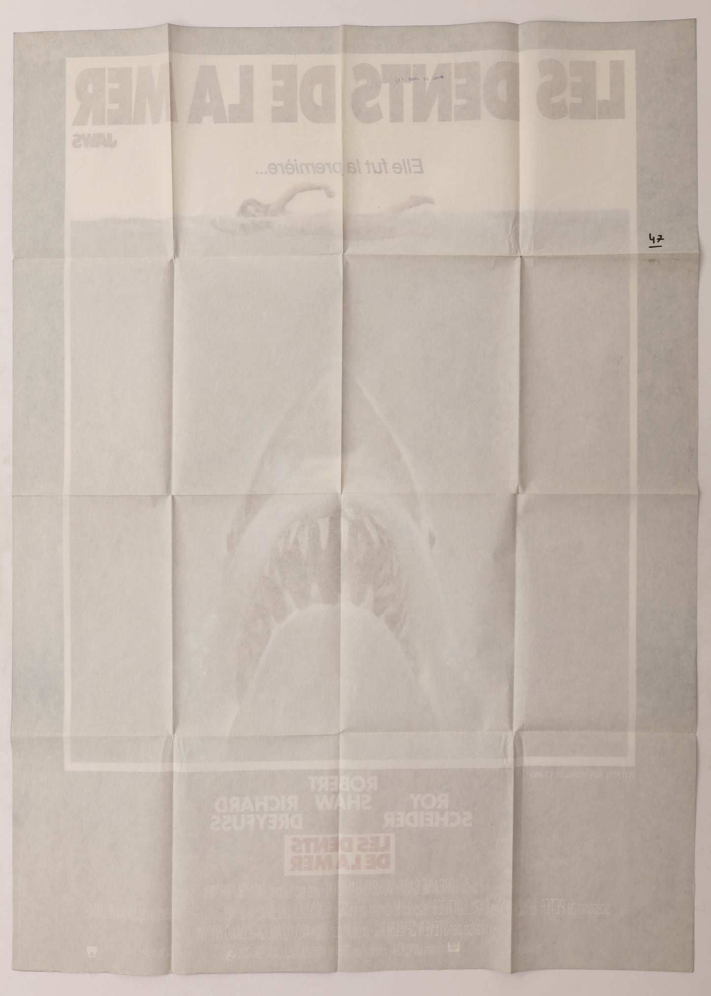 Back of original Jaws (1975) French Grande movie poster showing fold lines, reverse printing, and handwritten notations.