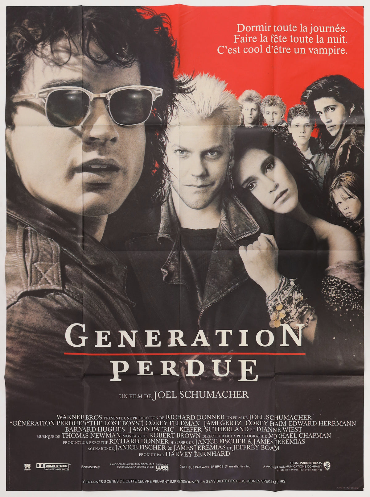 Original The Lost Boys 1987 French Grande movie poster featuring Kiefer Sutherland, Jason Patric, Jami Gertz, and the cast under the French title Génération Perdue.