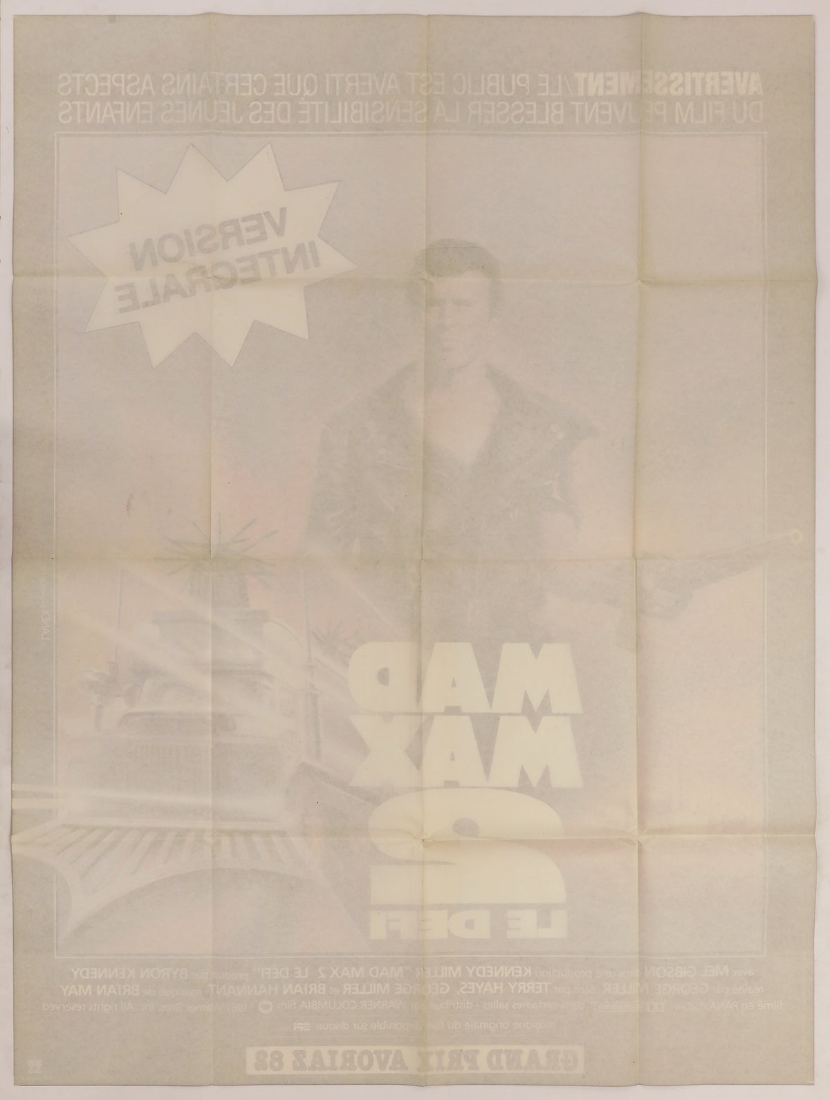 Back of French Mad Max 2 movie poster showing original fold lines, toning, and faint image bleed-through