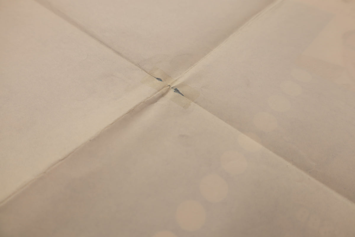 Close-up of the reverse of the Marilyn 1963 one sheet poster showing an older tape repair reinforcing a fold intersection.