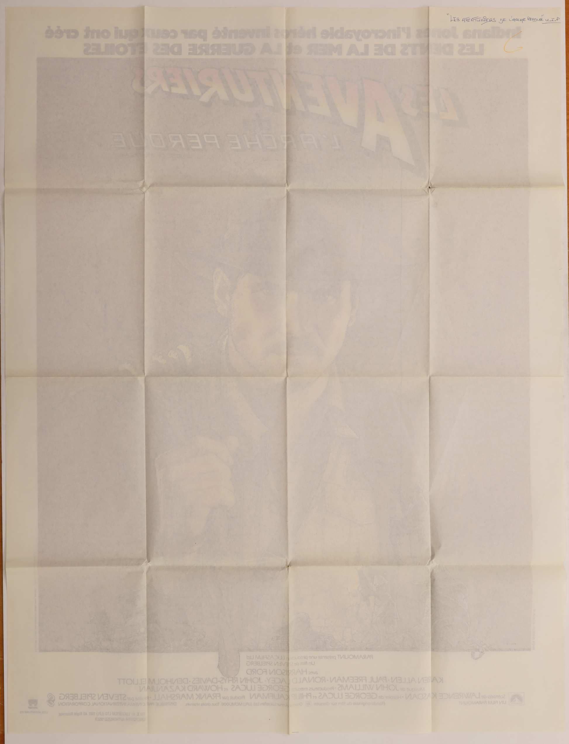 Back of original Raiders of the Lost Ark (1981) French Grande movie poster showing fold lines, reverse printing, and handwritten notation.