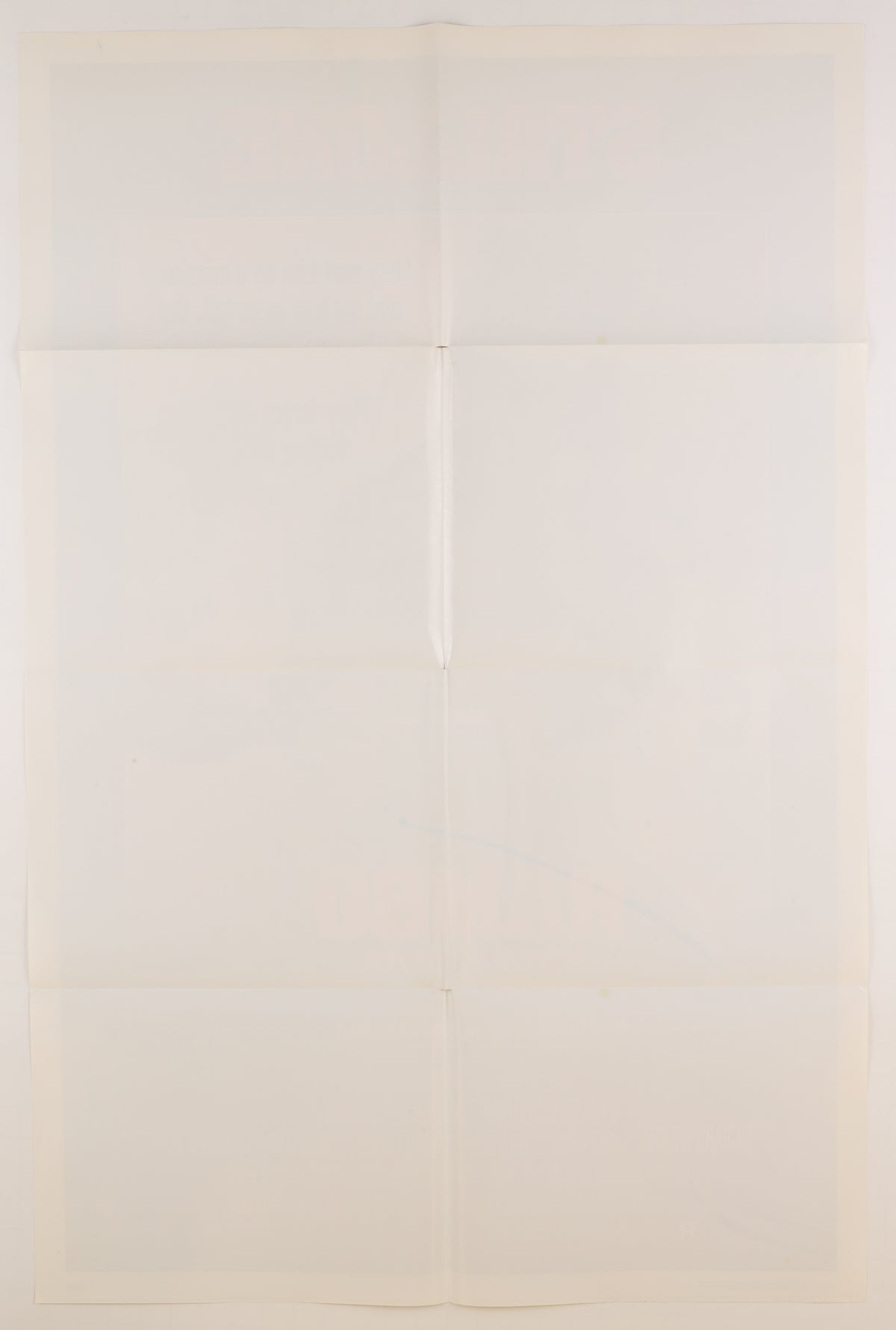 Reverse of a folded 1985 U.S. one sheet for Rambo: First Blood Part II, showing the horizontal and vertical fold pattern, light toning, faint discoloration, and minor surface marks.