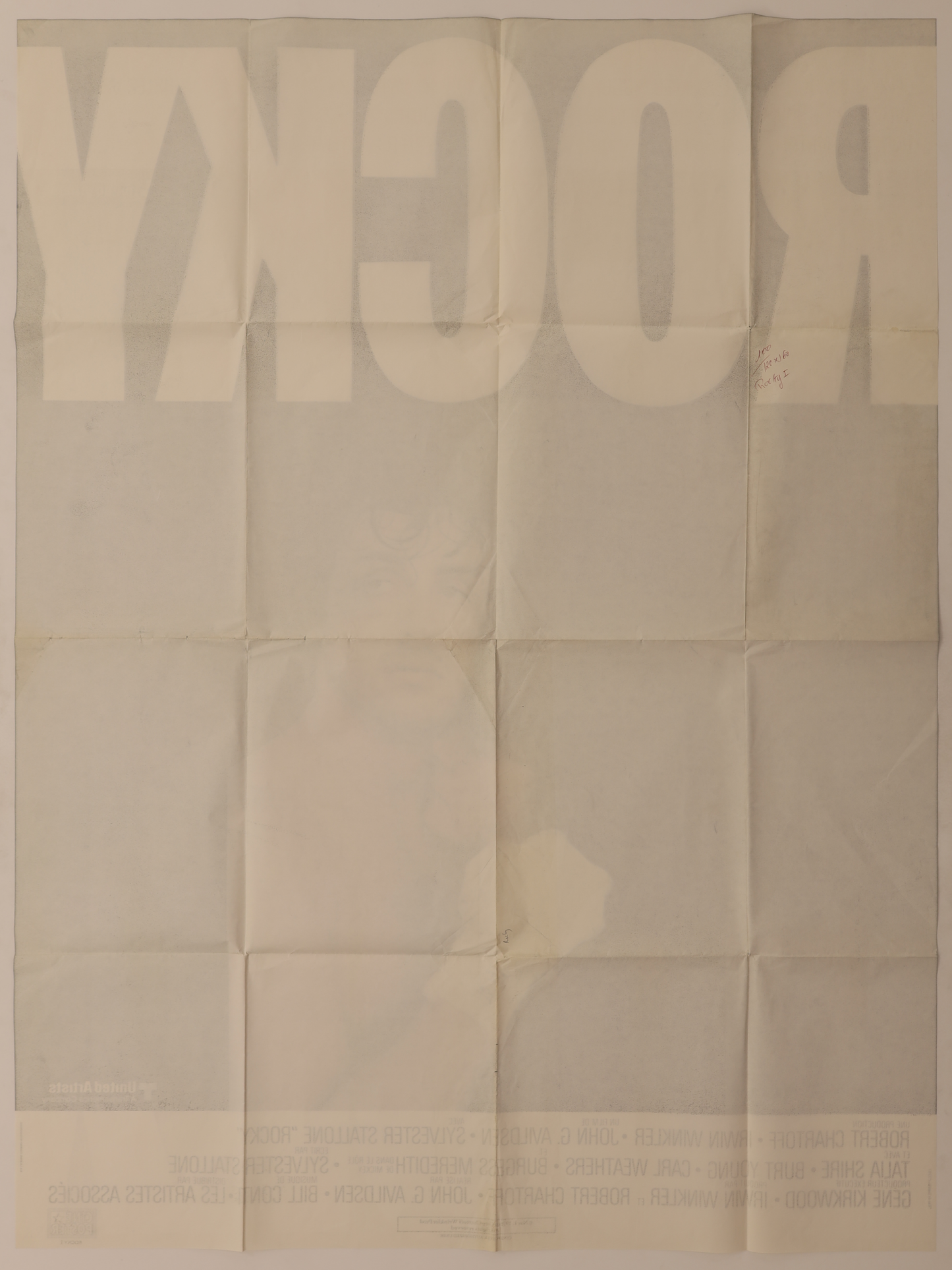 Back of original Rocky (1976) French Grande movie poster showing fold lines, reverse printing, and handwritten notation.