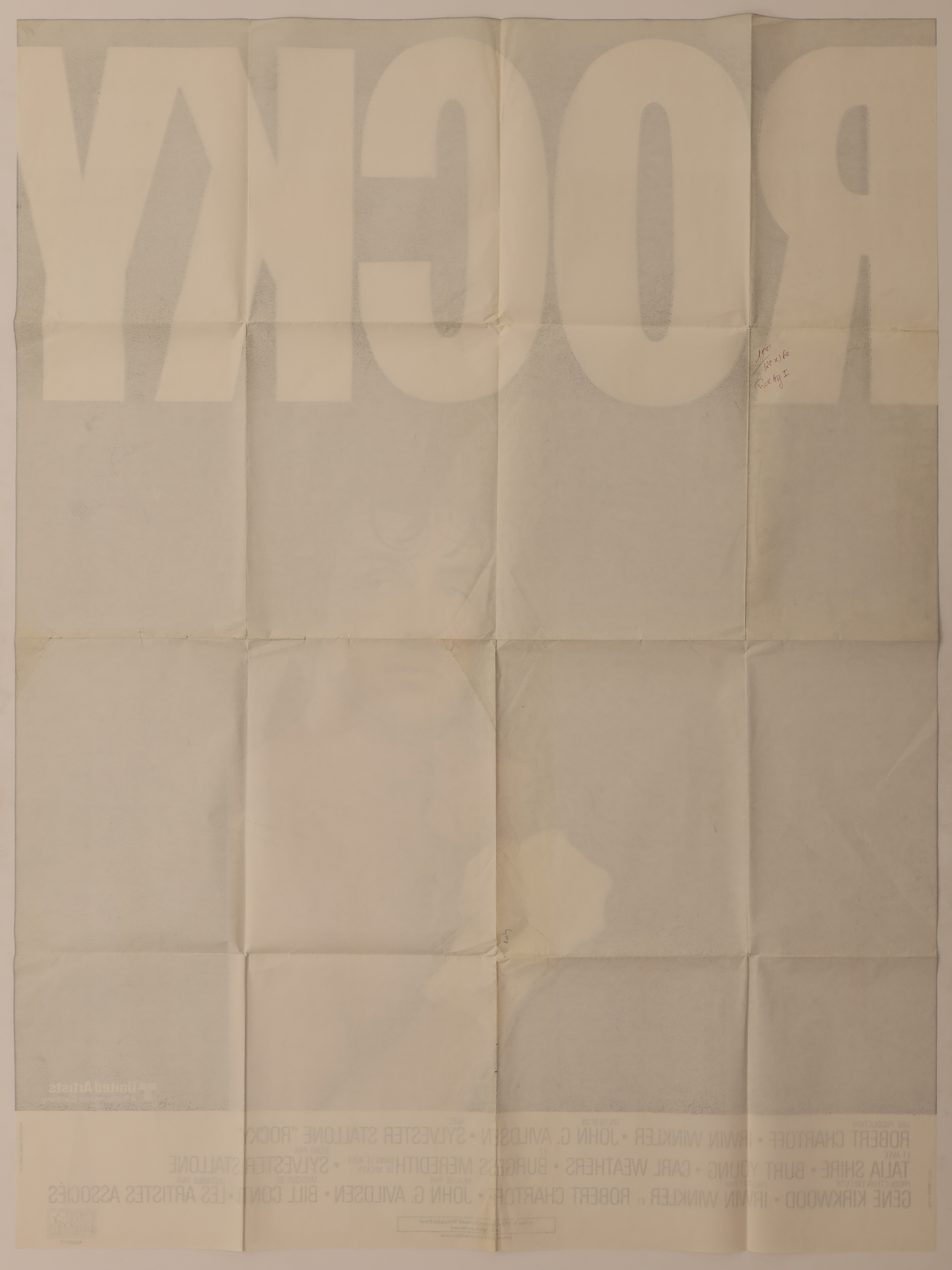 Back of original Rocky (1976) French Grande movie poster showing fold lines, reverse printing, and handwritten notation.