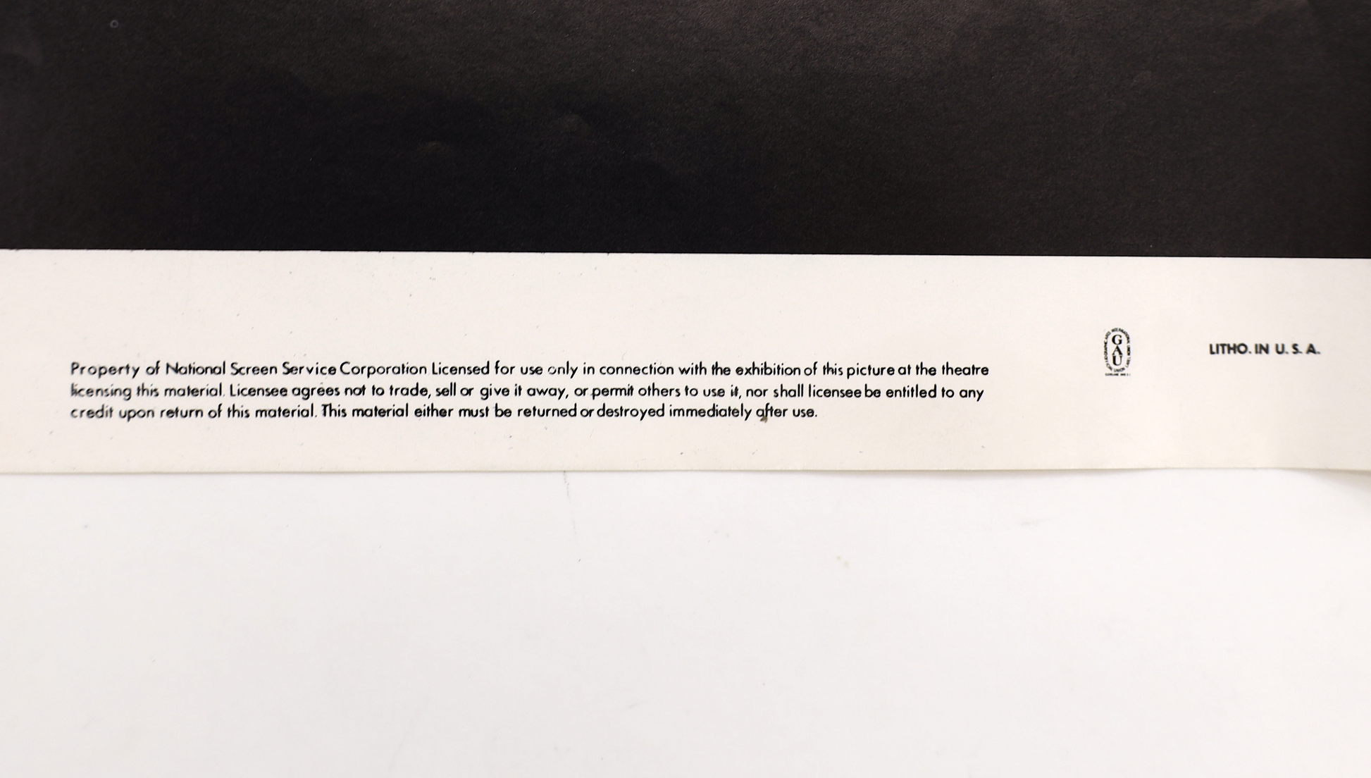 Close-up of bottom edge of Scarface (1983) one sheet movie poster showing National Screen Service text and Litho in U.S.A. marking.