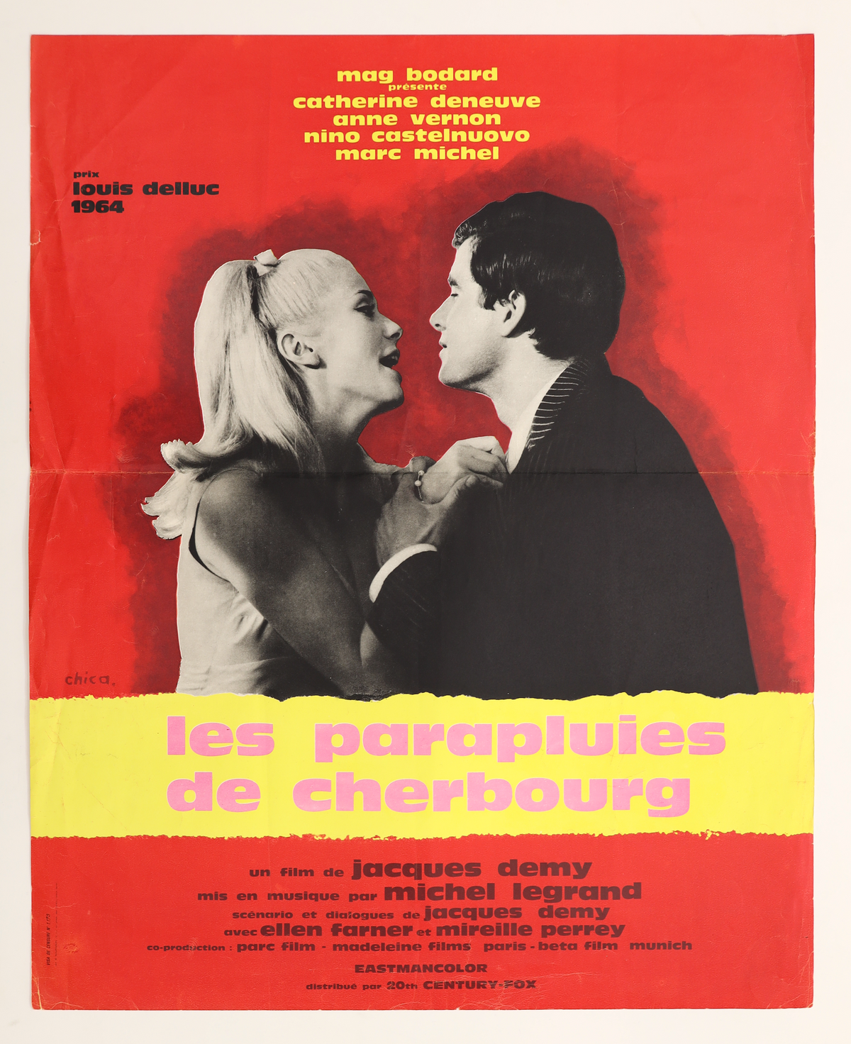 Original The Umbrellas of Cherbourg 1964 French small movie poster featuring Catherine Deneuve and Nino Castelnuovo against a red background with yellow and pink title lettering.