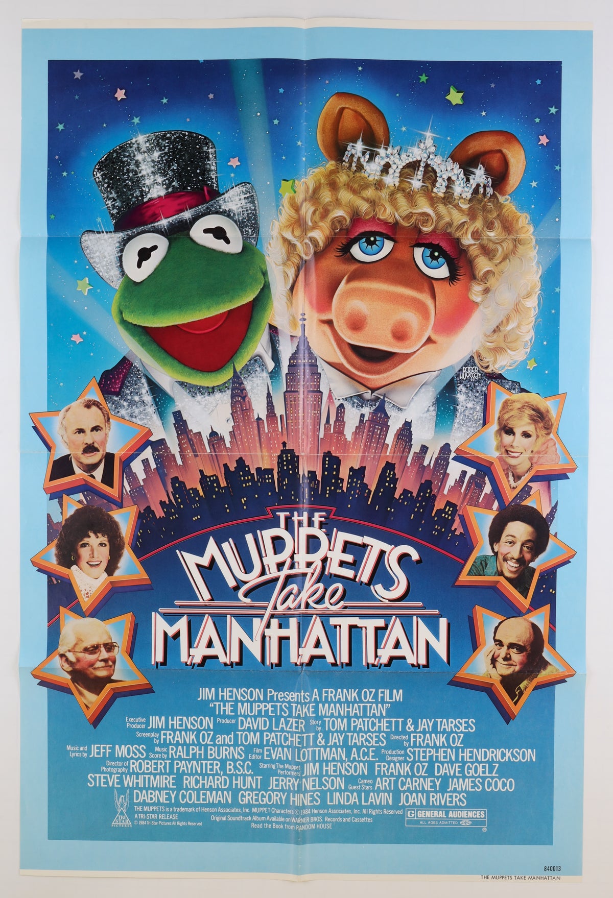 Front of the 1984 U.S. one sheet featuring Kermit and Miss Piggy above the Manhattan skyline with portraits of the film's guest stars and credits below.