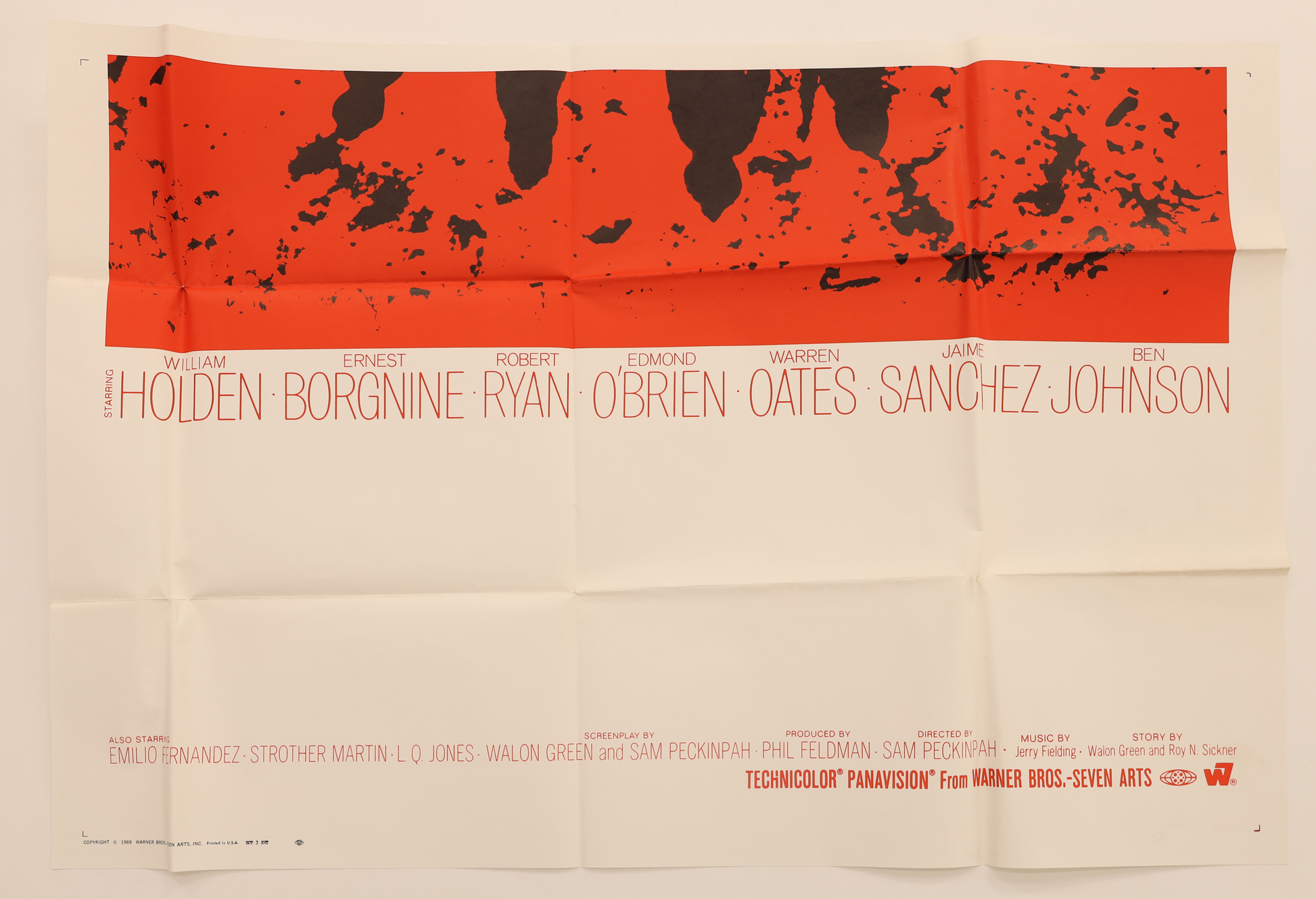 Bottom section of The Wild Bunch (1969) foreign three sheet movie poster showing the cast credits and red-and-black silhouette artwork.