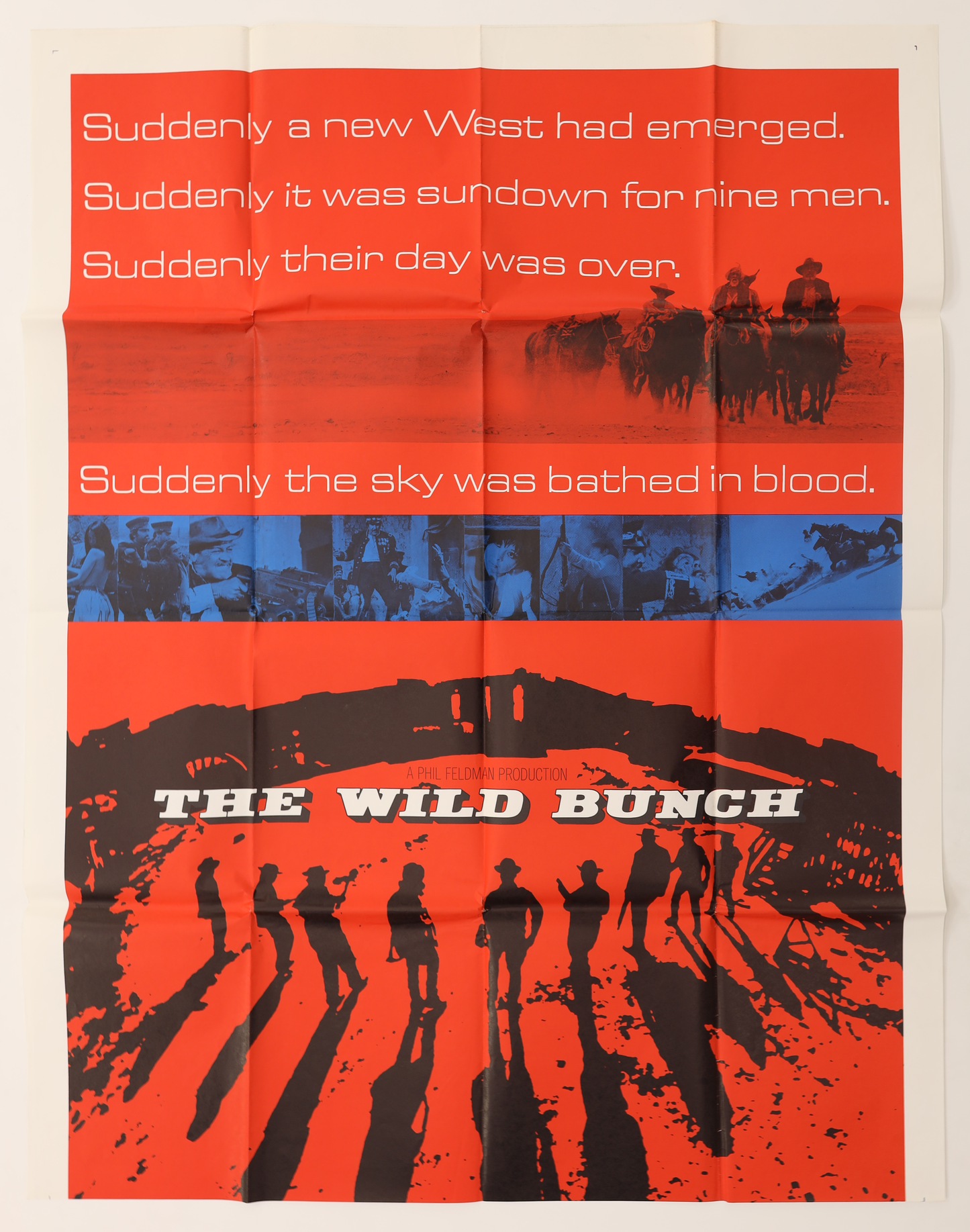 Top section of The Wild Bunch (1969) foreign three sheet movie poster showing the red Western landscape, riders, and tagline.