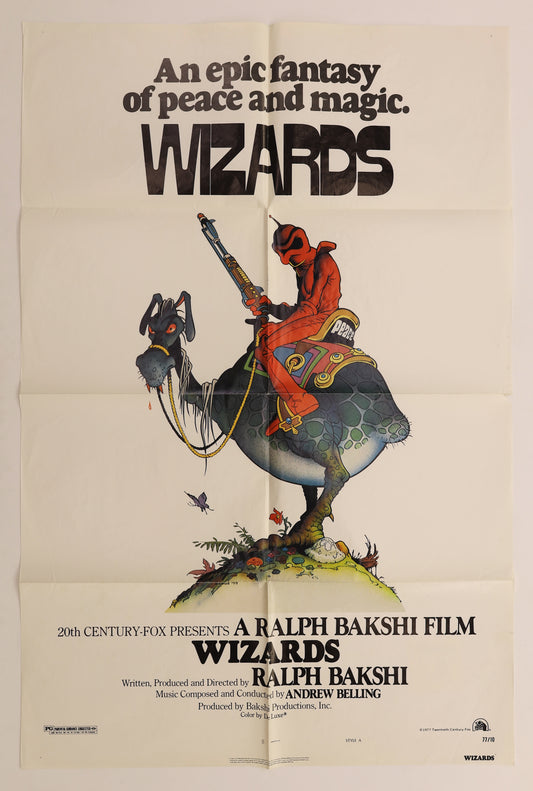 Original Wizards 1977 U.S. one sheet movie poster for Ralph Bakshi's animated fantasy film, featuring a red-clad rider with a rifle seated on a fantastical creature beneath the large Wizards title.
