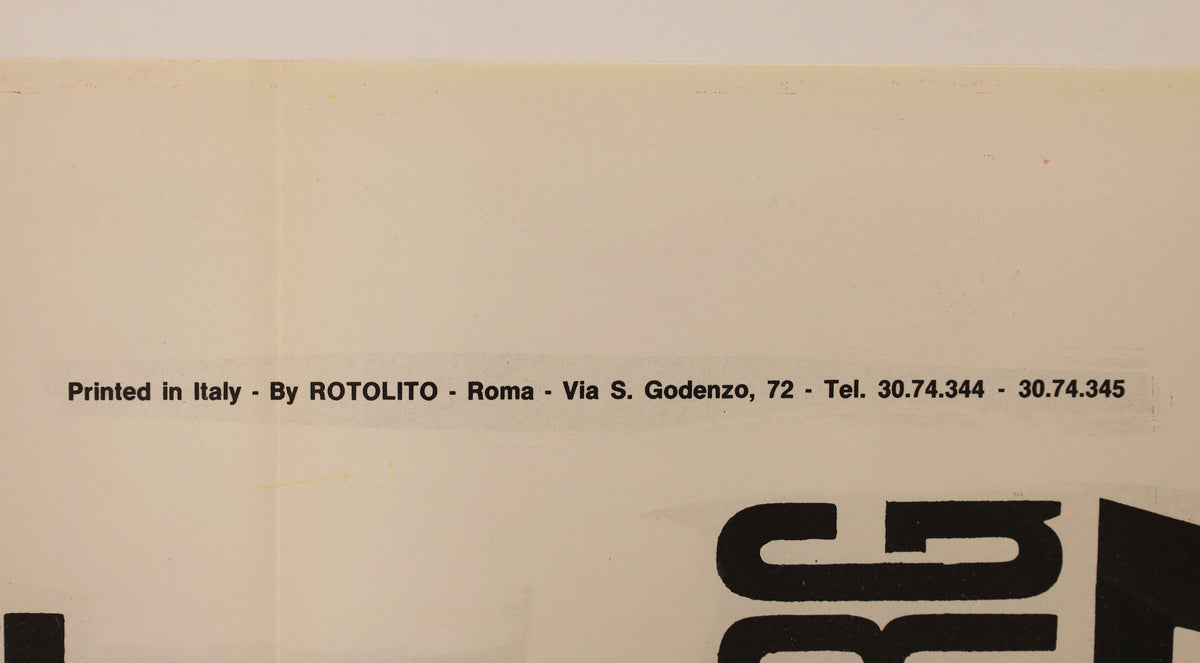 Close-up showing the printed-in-Italy credit for Rotolito, Rome, with fold lines and light surface discoloration.