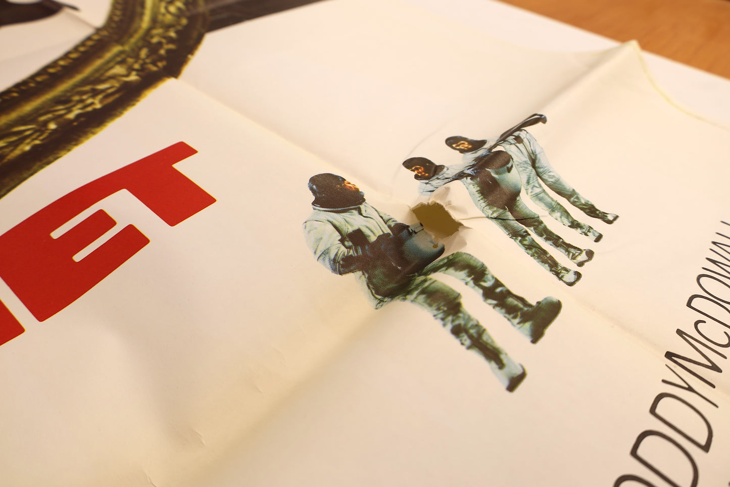 Close-up of the Escape from the Planet of the Apes 1971 international three sheet poster showing paper loss and tearing near the central character artwork.