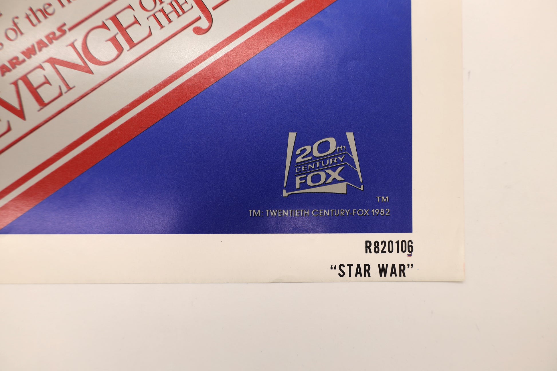 Close-up of Star Wars 1982 re-release one sheet poster showing the 20th Century Fox copyright, NSS number R820106, and Star War printing identification.