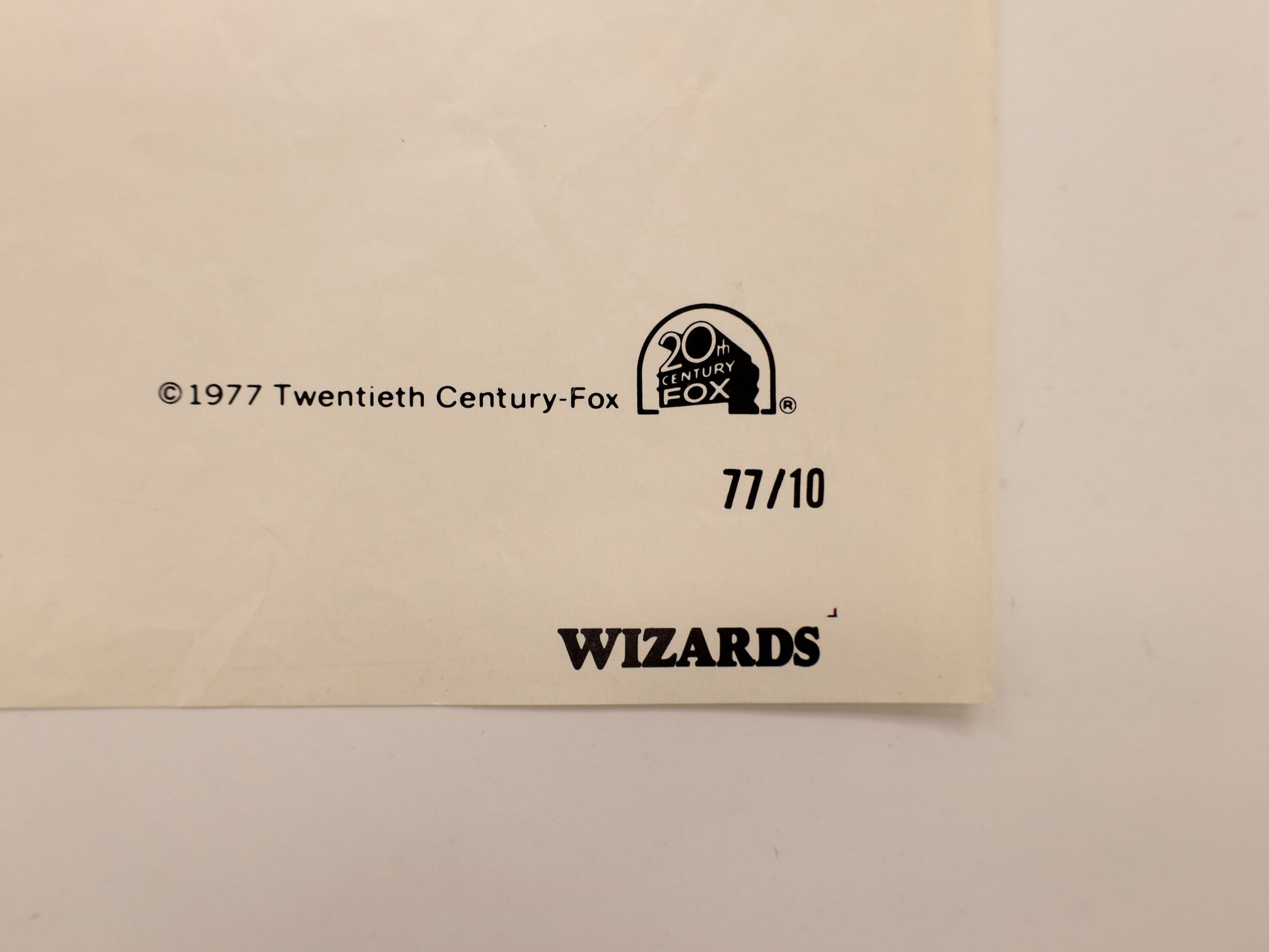 Close-up of lower right corner of Wizards 1977 one sheet showing the 20th Century Fox copyright, 77/10 printing number, and Wizards title.